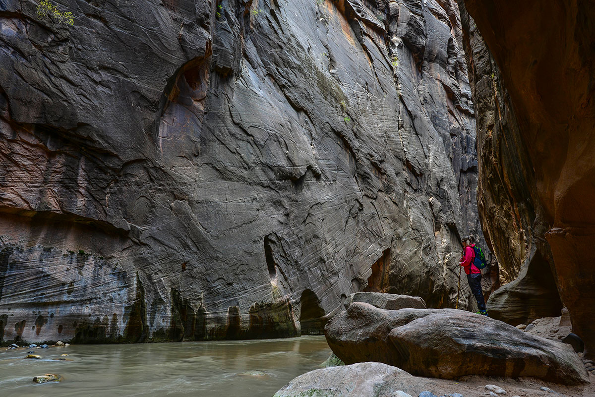 Photo of a hiker enjoying a view from the Narrows hiking trail.